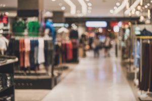 Blurred photo of the inside of a clothing retailer.